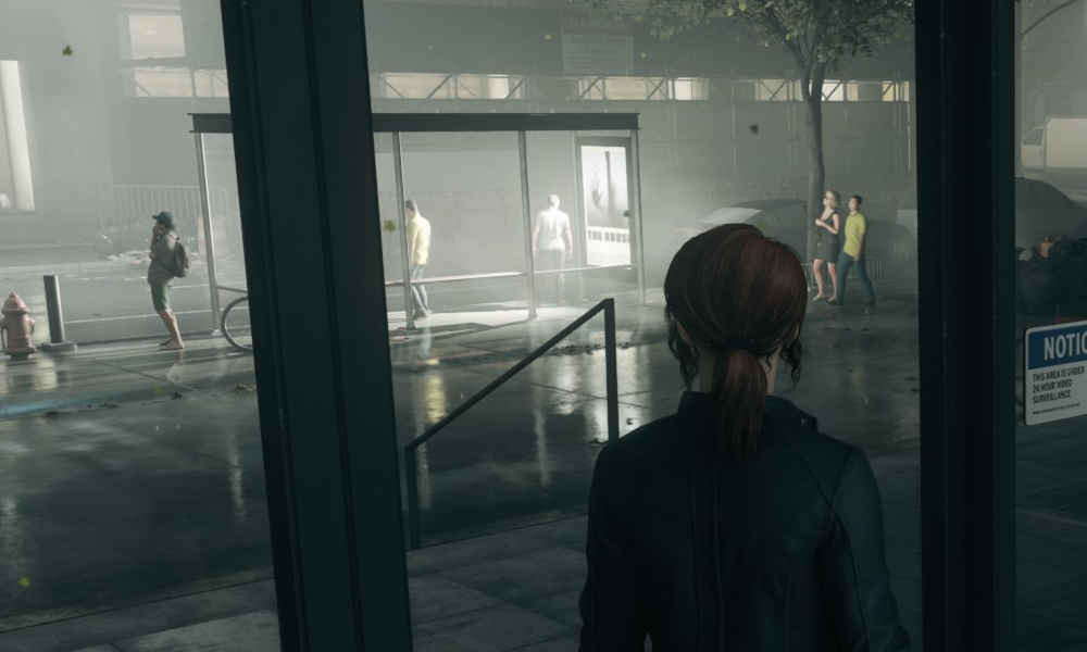 Looking out from the lobby of the Oldest House at the bus stop.