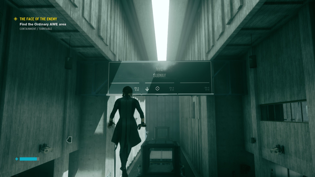 Jesse hovers in front of an NYC Subway sign.