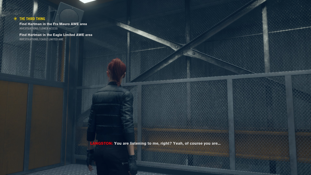 Jesse stands in an elevator, listening to Langston over the intercom.