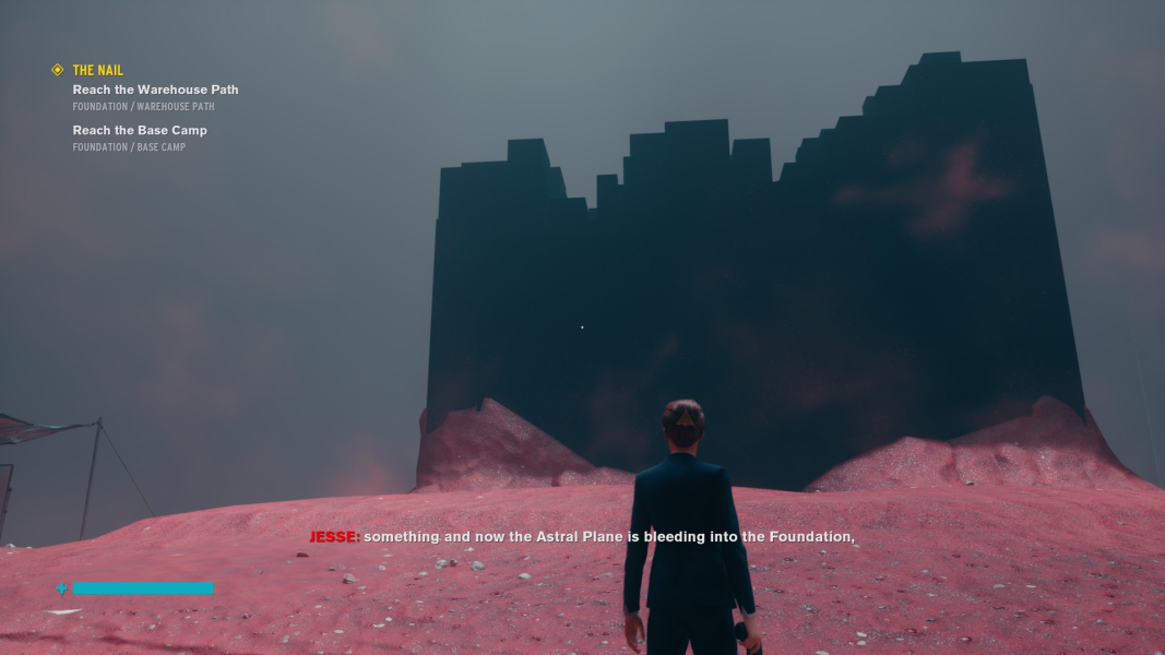 Jesse stands in front of the partially-destroyed Nail.