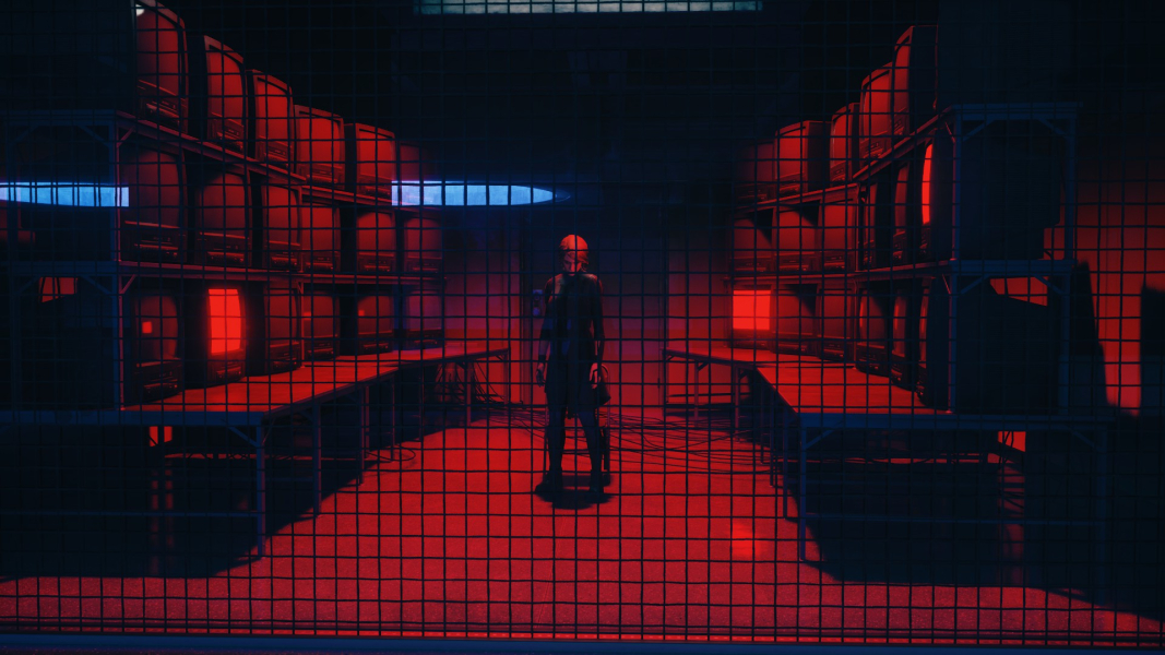 A doppelganger of Jesse stands in a room surrounded by monitors. The light is very red.